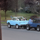 She seems to be admiring the Jeep as well